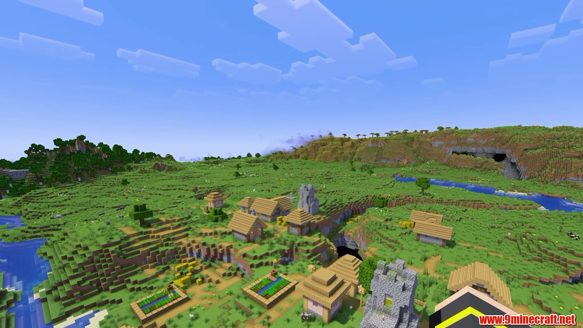 Rails and cavern breaking the surface beside the village