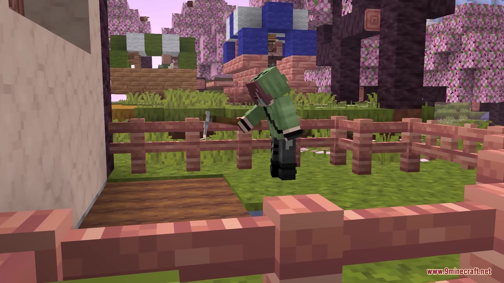 Minecraft player using a 3D hoe to till soil in a garden