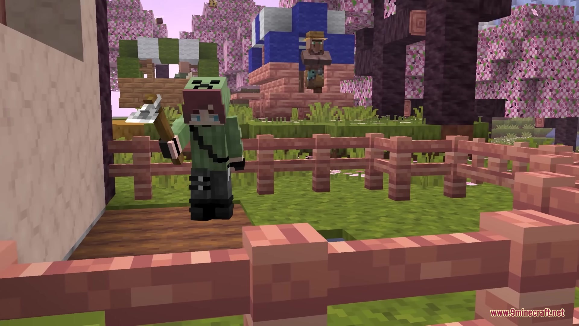 A player holding a chunky 3D axe tool in a cherry blossom biome