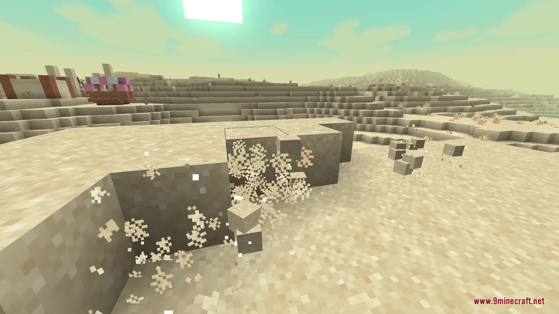 Breaking sand blocks in a desert biome with many small particles flying around