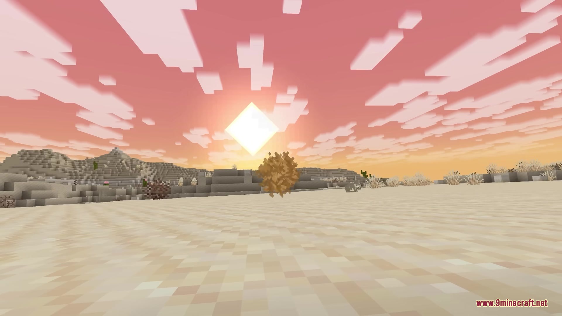 Tumbleweeds Mod Screenshot 4 A tumbleweed moves through the sandy desert under a vibrant pink sunset sky