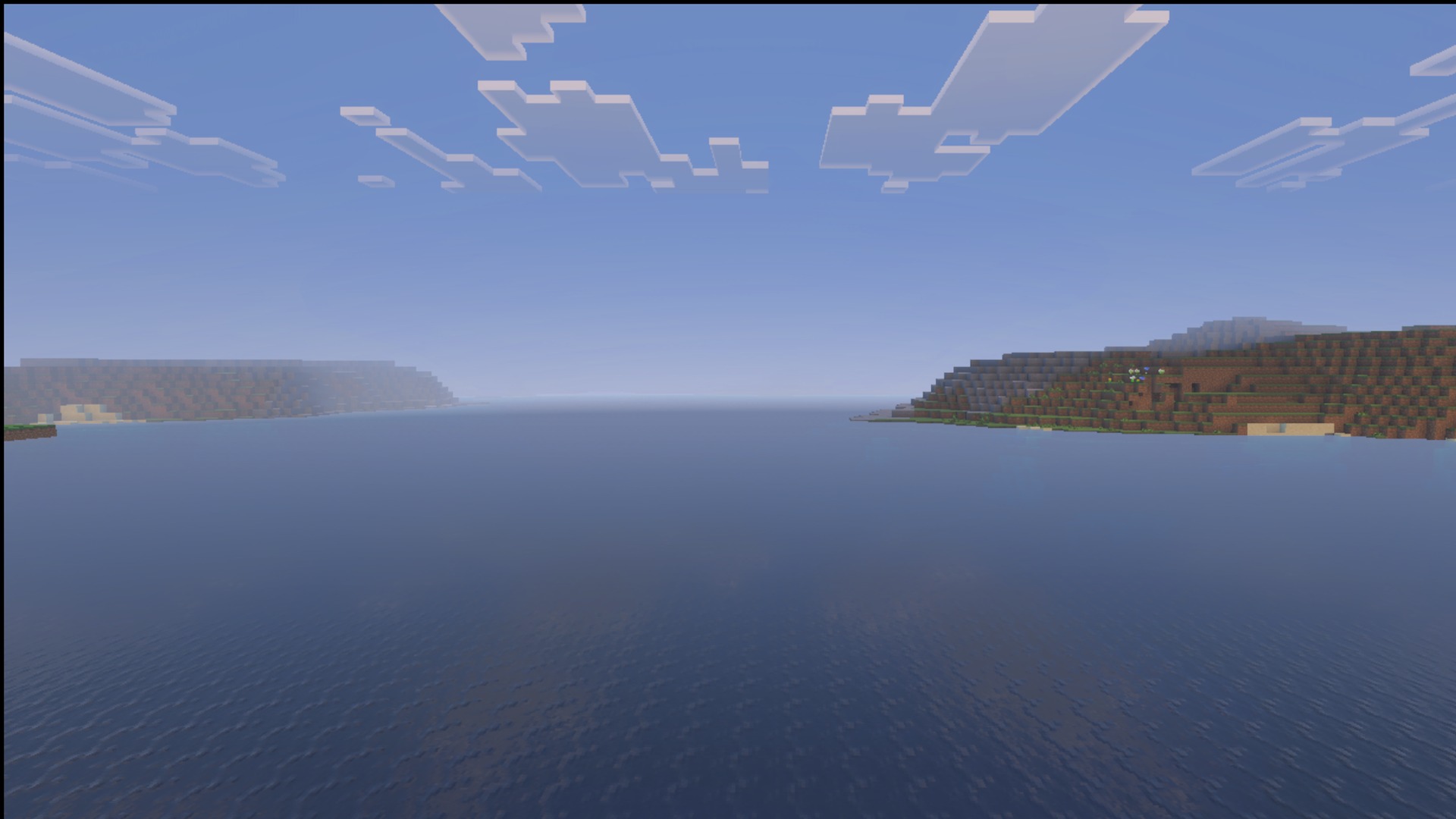 Daytime ocean water, clouds and shoreline with the Ultimate Survival pack
