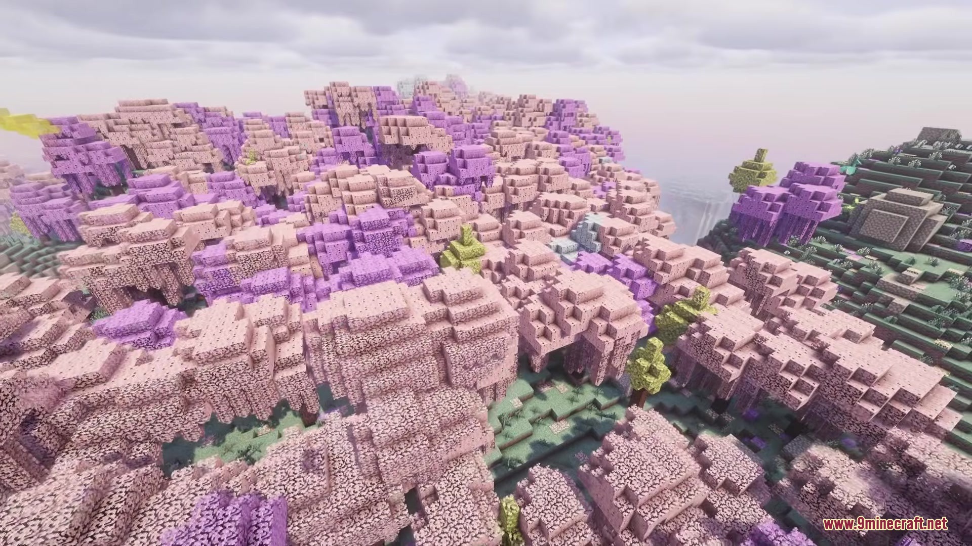 A vast landscape filled with vibrant pink and purple trees in Minecraft