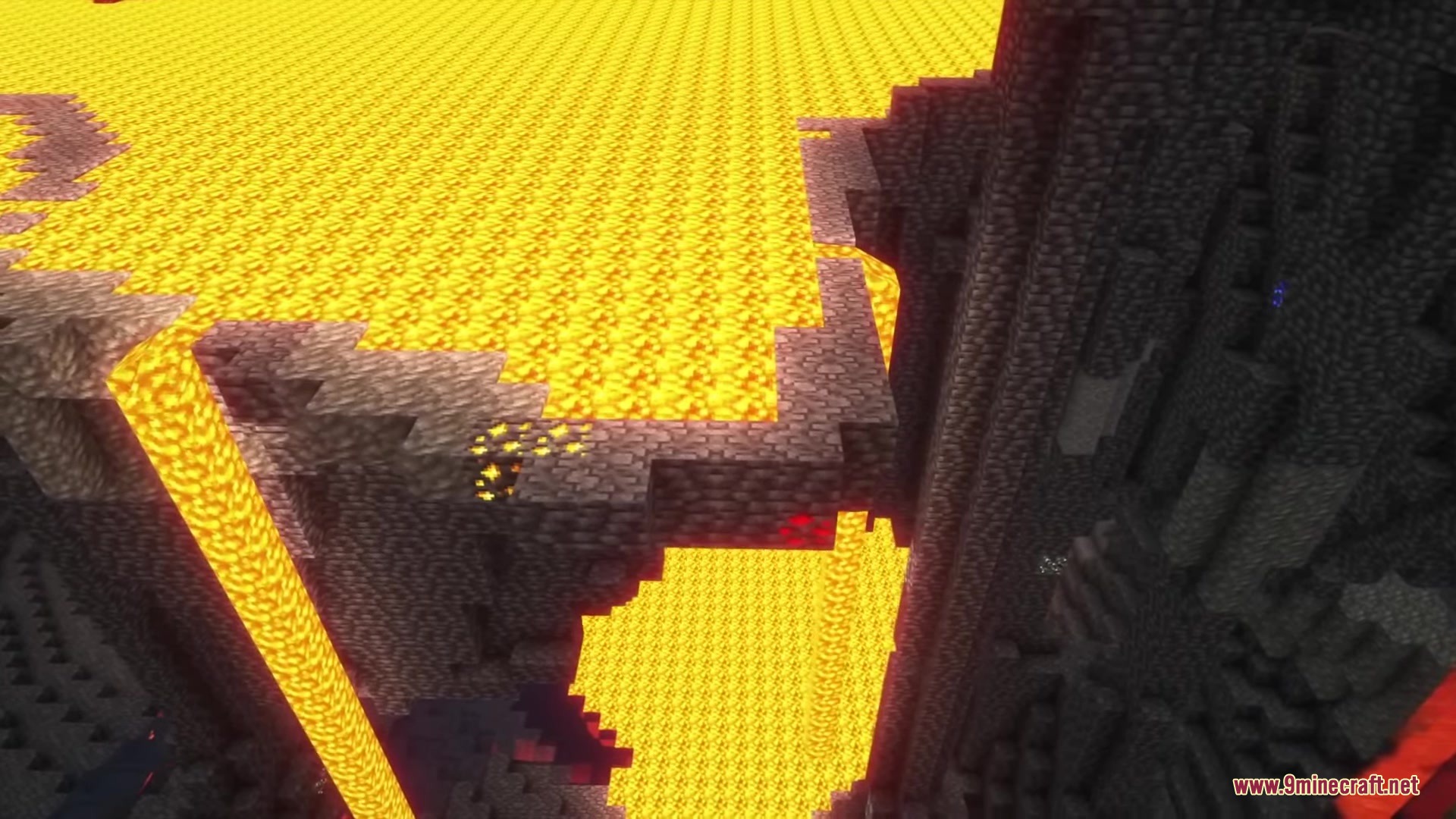 UnderMod Mod Screenshot 1 A massive underground lava lake with a stone bridge and gold ore