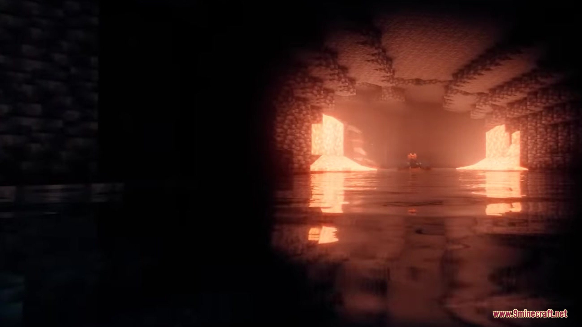 UnderMod Mod Screenshot 12 A dark flooded sewer tunnel with bright orange light reflecting on the water