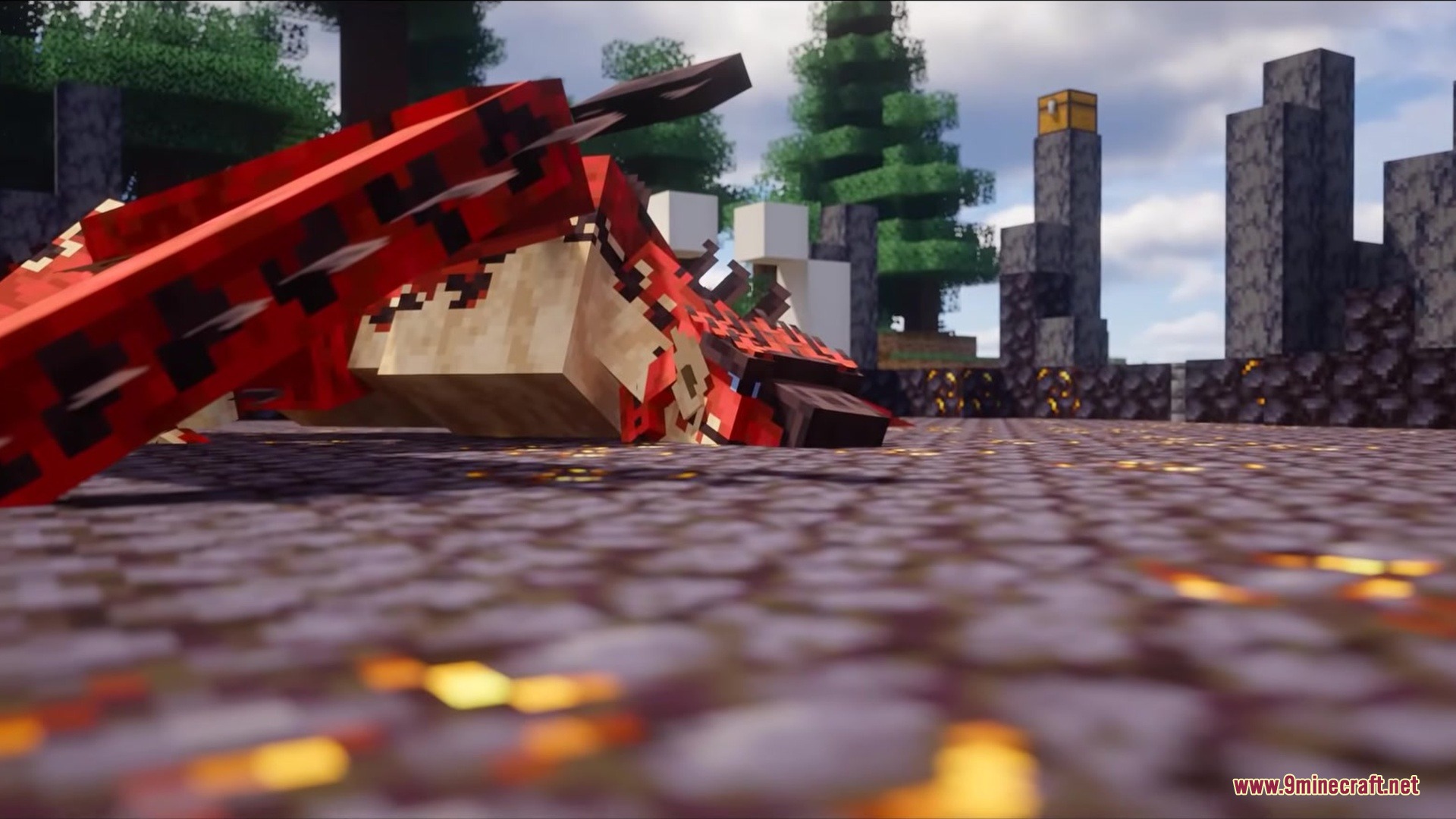Red dragon monster resting on stone ground near a chest