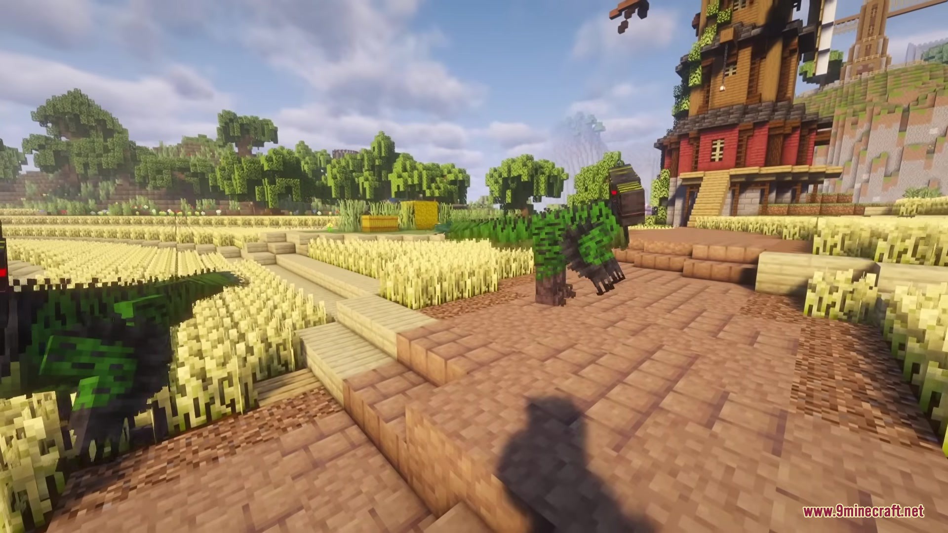 A dangerous green dinosaur stalks through a wheat field near a wooden building