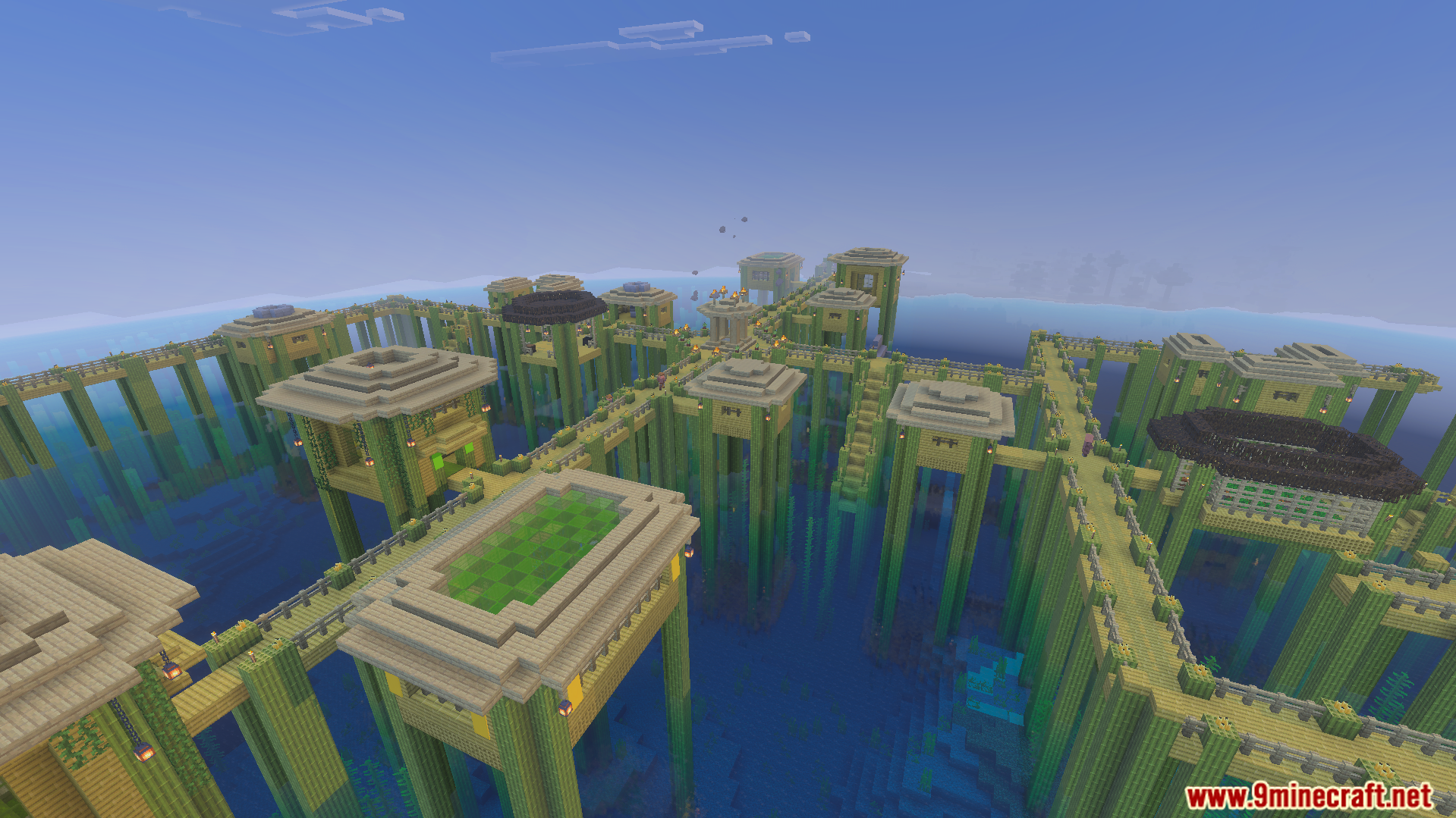 Large village structure built on tall bamboo stilts over the ocean water