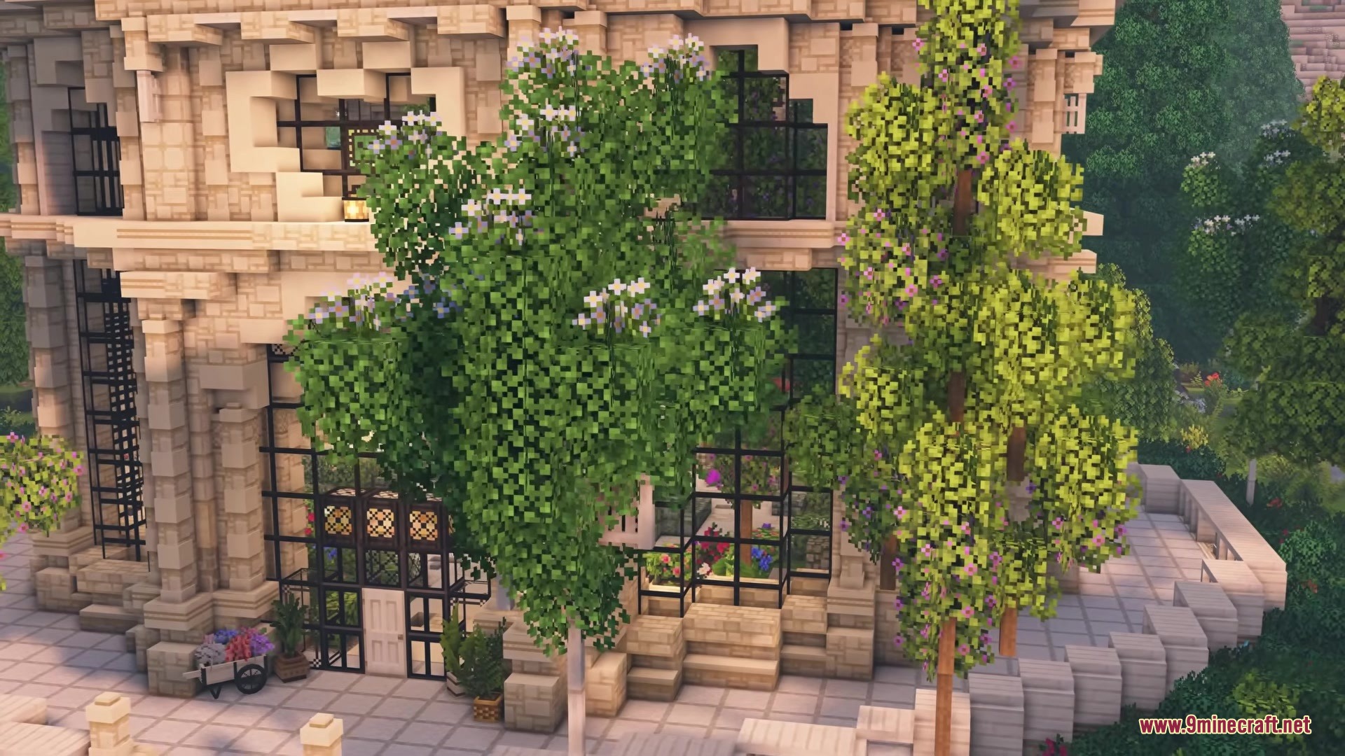 Vines & Leaves Hotbar Resource Pack Screenshot 3 Elegant stone building with large windows surrounded by lush flowering trees
