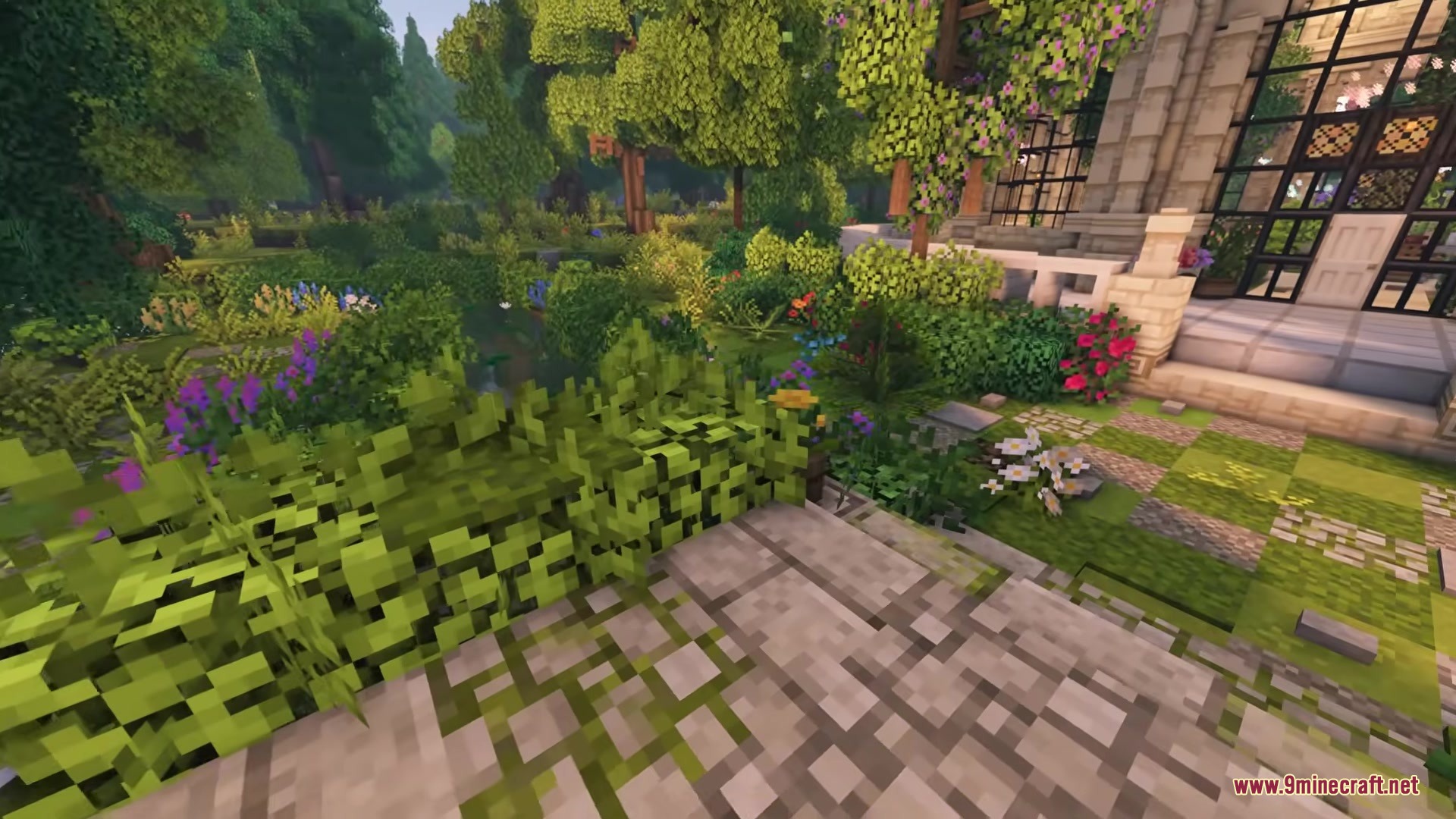Vines & Leaves Hotbar Resource Pack Screenshot 7 Vibrant flowers and lush greenery surround a stone path in a Minecraft garden