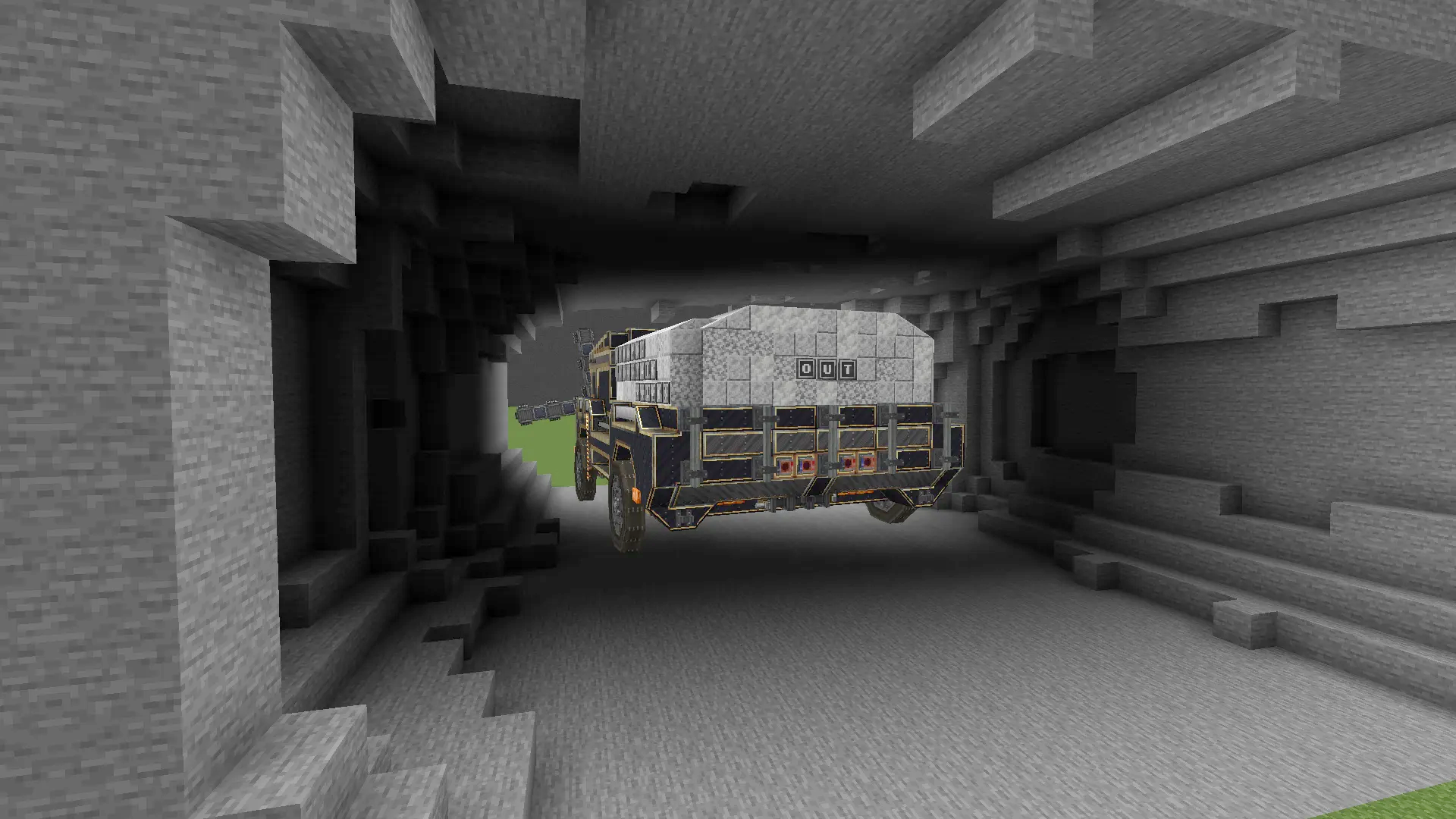 Rear view of a heavy mining truck parked inside a newly dug excavation
