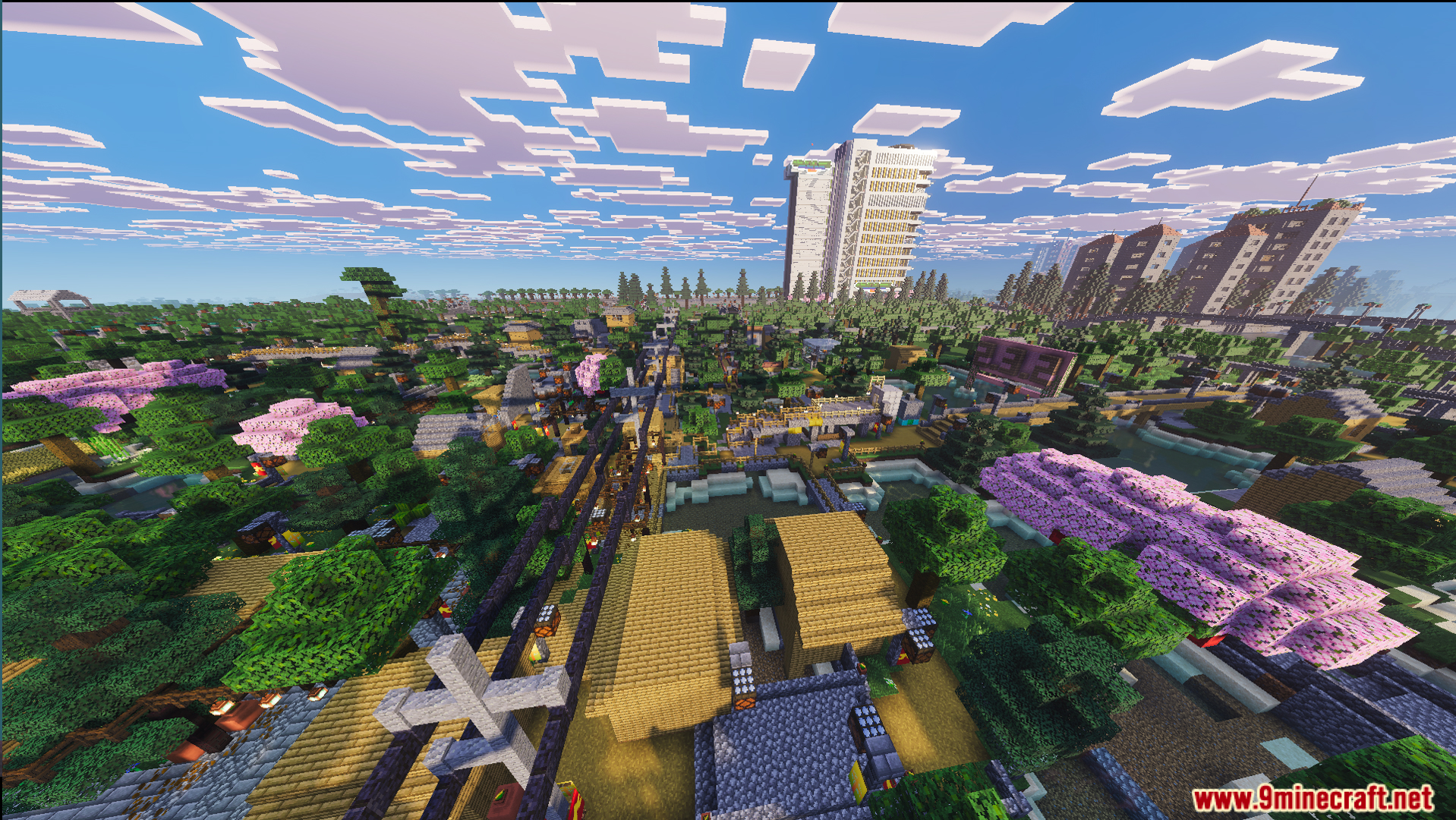 Aerial view of a modern city featuring grand boulevards and tall buildings