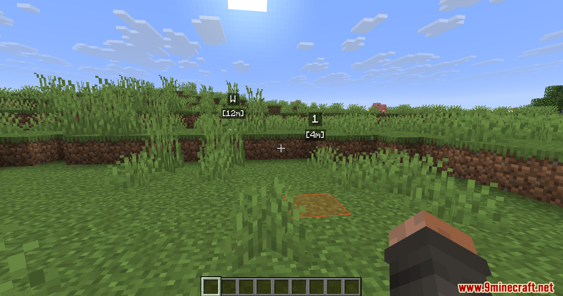 WWaypoints Mod Screenshot 4 Waypoint markers and an orange block highlight guide the player in Minecraft