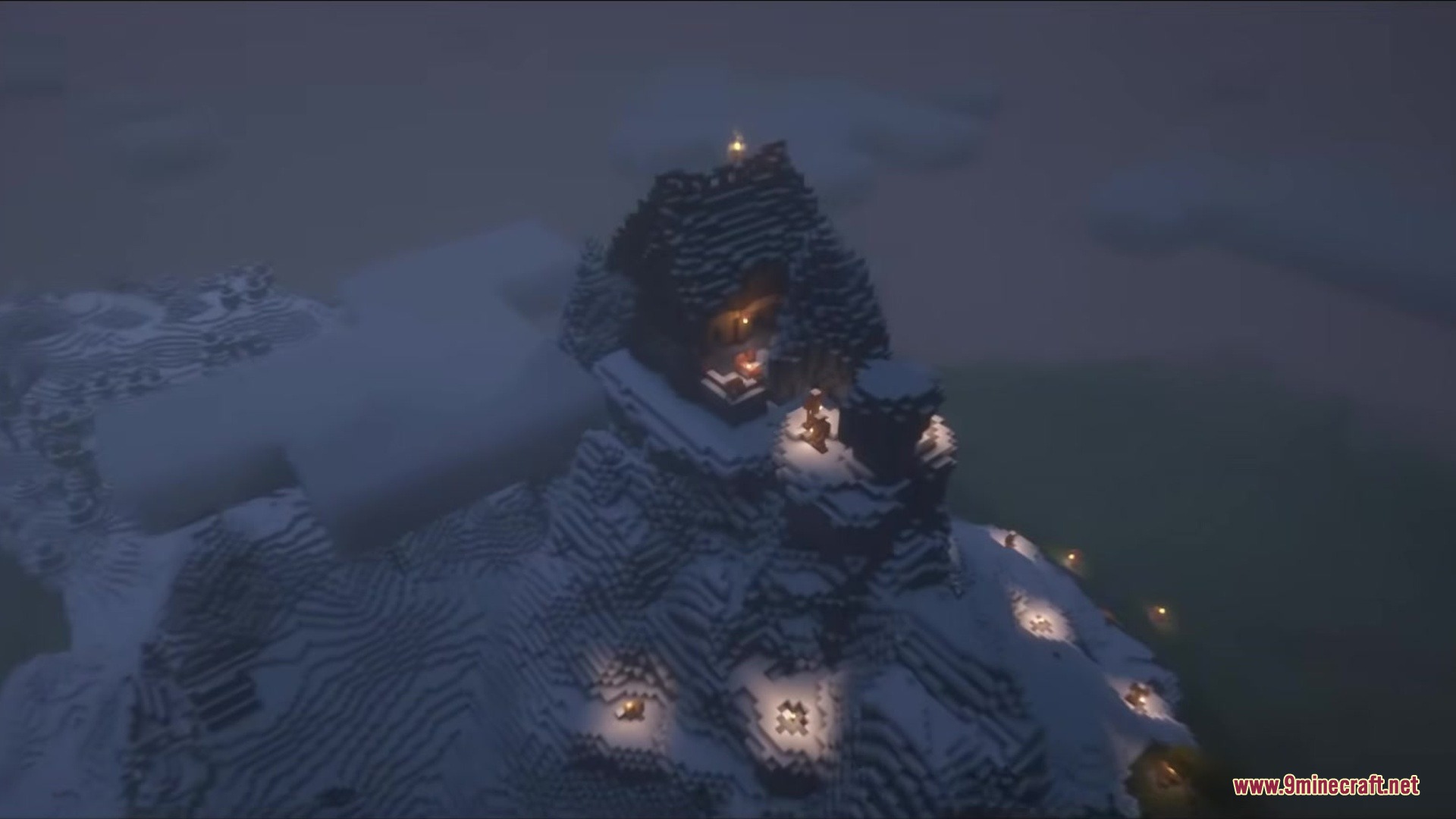 Wandrous Mod Screenshot 6 Small stone building lit by torches on a snowy mountain peak