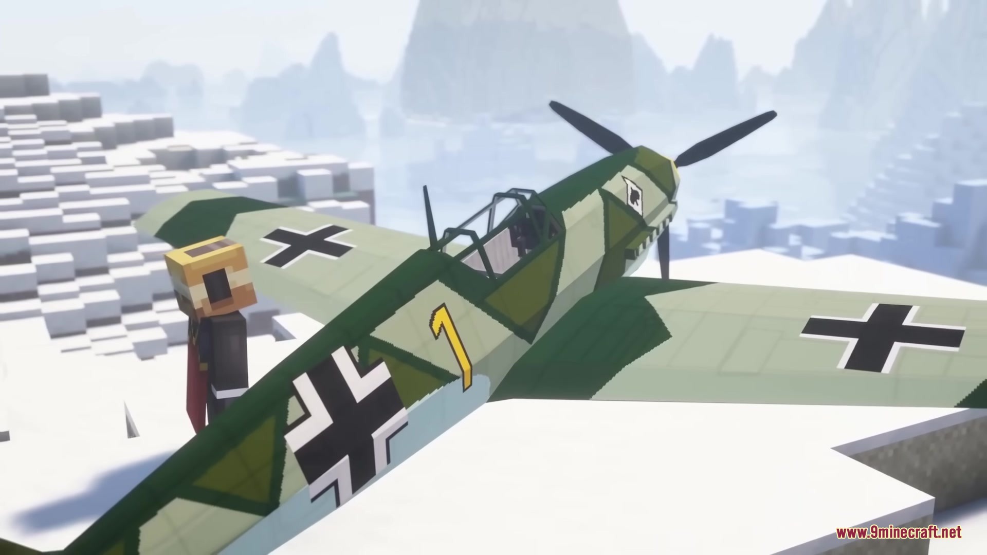 Warfare Wings Mod Screenshot 13 A player stands next to a German fighter plane on a snowy mountain