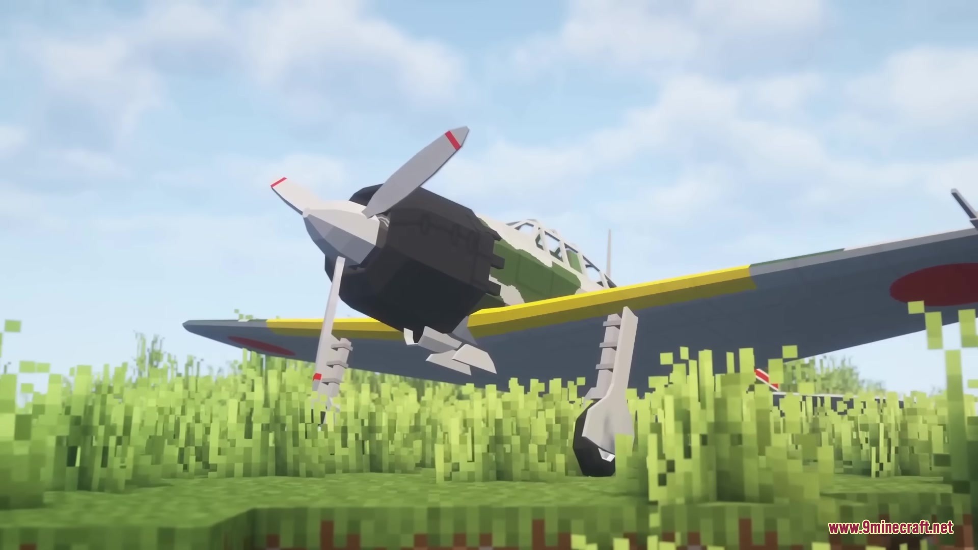 Warfare Wings Mod Screenshot 15 A Japanese fighter plane sits in a field of tall green grass