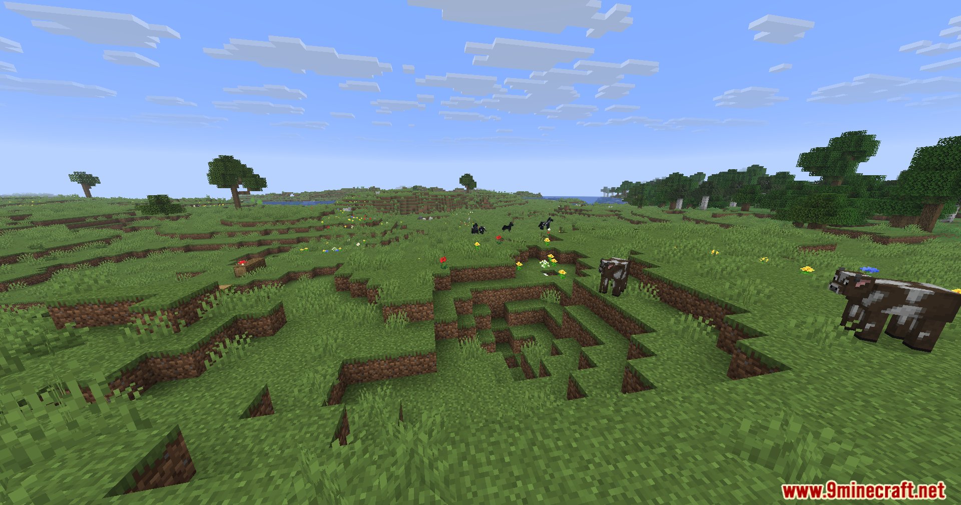 WayGL Mod Screenshot 7 Cows grazing in a vast green plains biome under a bright blue sky