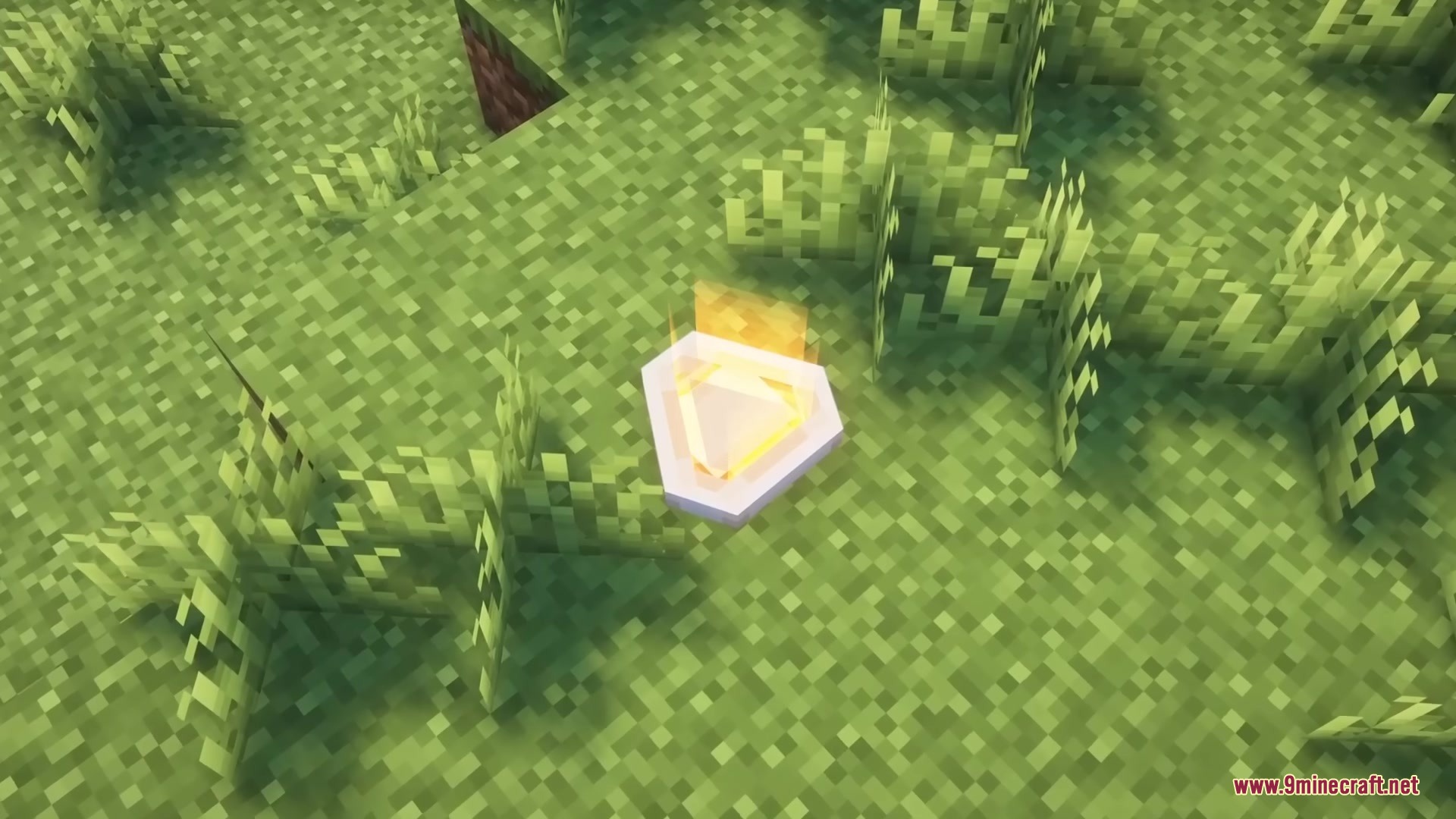 A glowing orange battery item placed on the ground in a Minecraft world