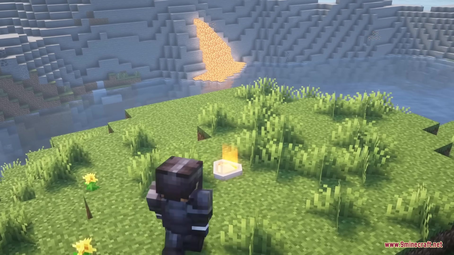 A player stands near a glowing task marker overlooking a distant lava waterfall