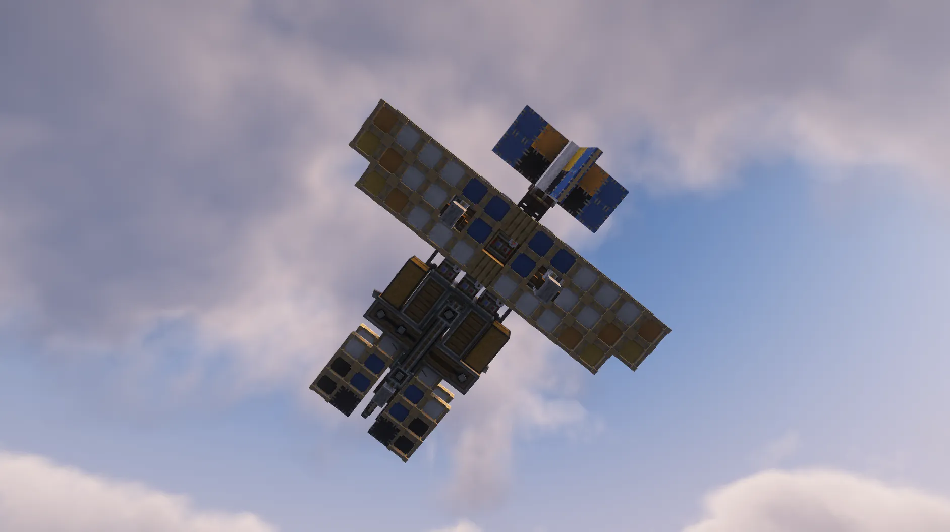 A colorful survival plane with engines flying through a cloudy sky