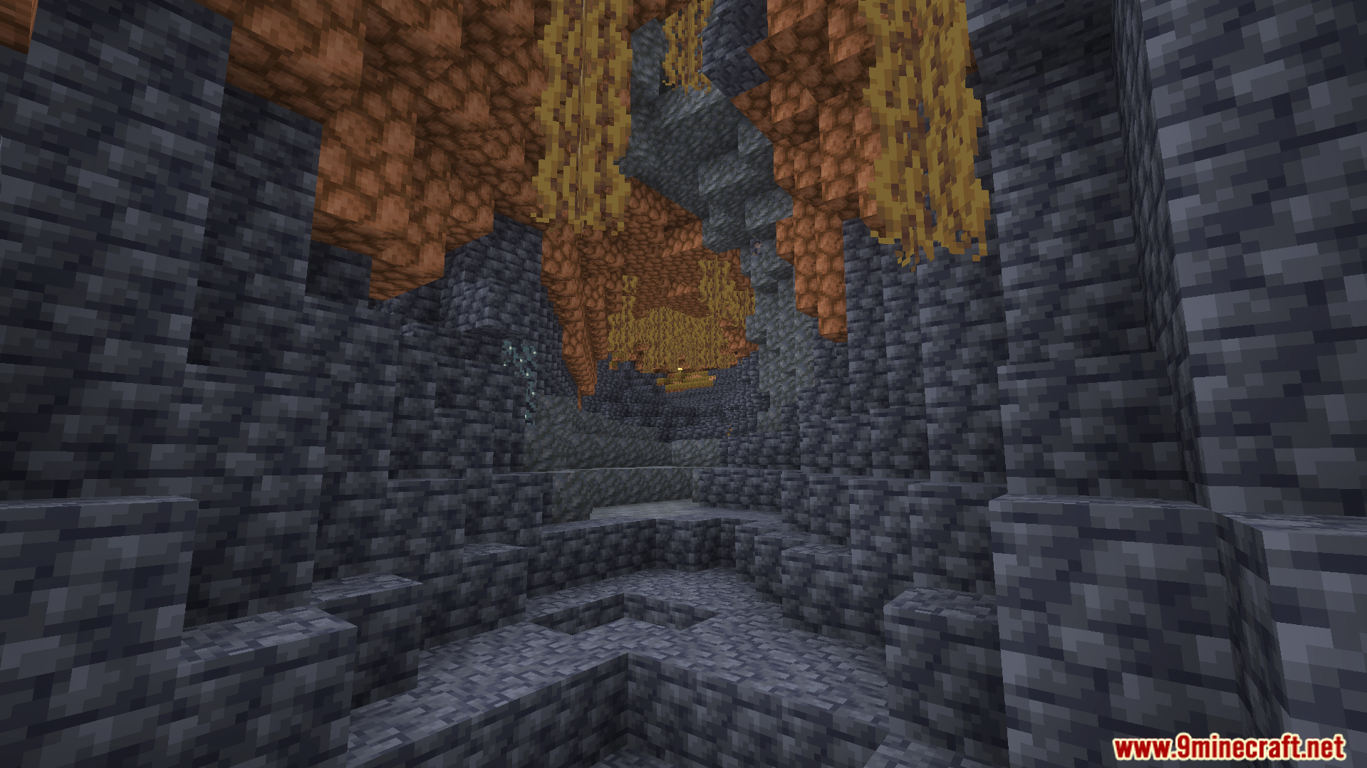 Wild Expansion Addon Screenshot 5 Dark stone cave with brown ceiling blocks and long hanging vines