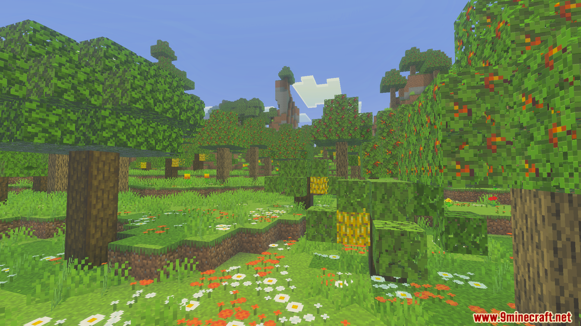 Wild Expansion Addon Screenshot 8 Lush green forest with flowering trees and colorful petals on the grassy ground