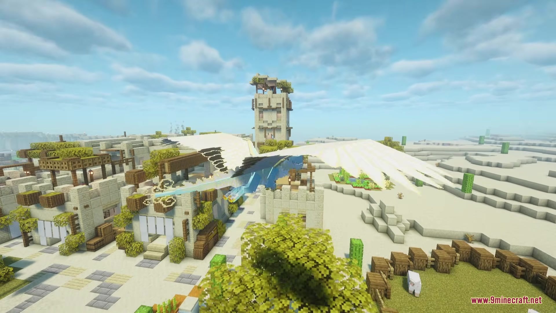 Wing Kirin Dragon Survival Addon Mod Screenshot 4 A blue dragon with large white wings glides over a desert village settlement