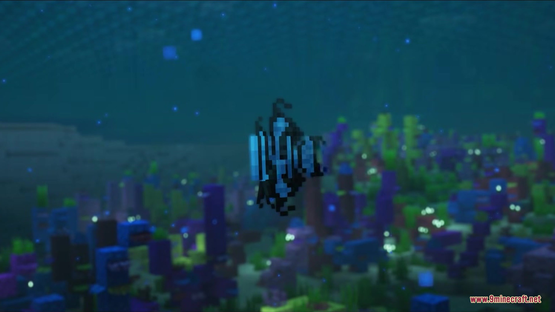 Wonderoussea Mod Screenshot 4 A tiny Blue Glaucus swims among vibrant coral blocks in warm water