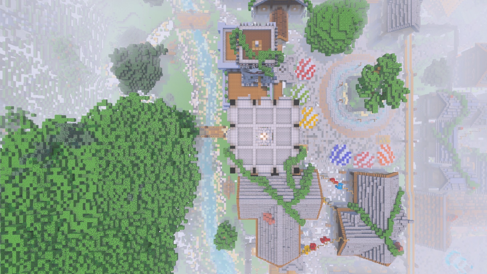 Top down view of a Minecraft village with houses trees and a river