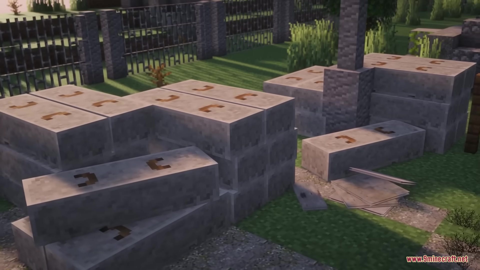 Stacked concrete slabs and blocks placed in a grassy outdoor area