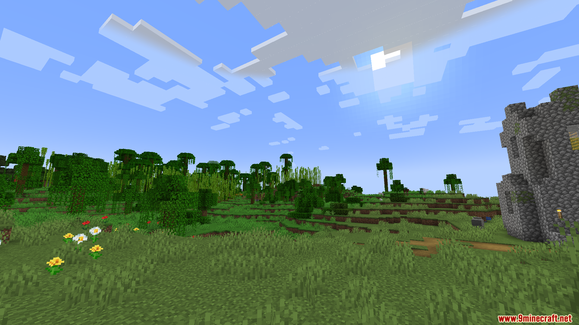 Zenith Attributes Spanish Translation Resource Pack Screenshot 6 Wide view of a Minecraft jungle biome with flowers and stone ruins
