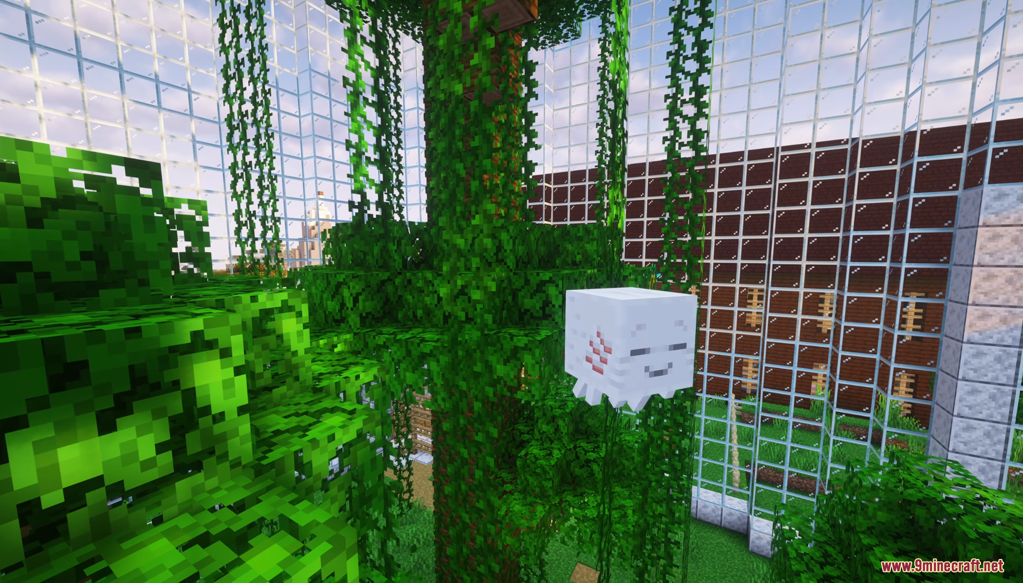 Small white mob floats near a vine covered tree inside a glass dome