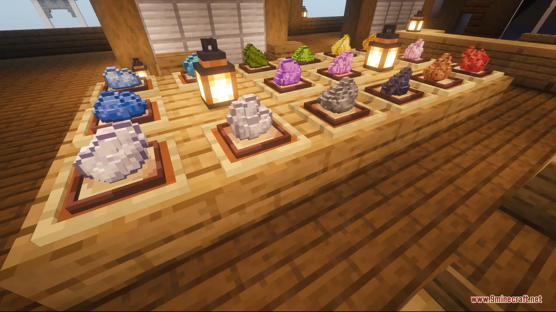 3D Items Vanillaism Resource Pack Screenshot 5 A display of colorful 3D items on wooden counters with warm lanterns