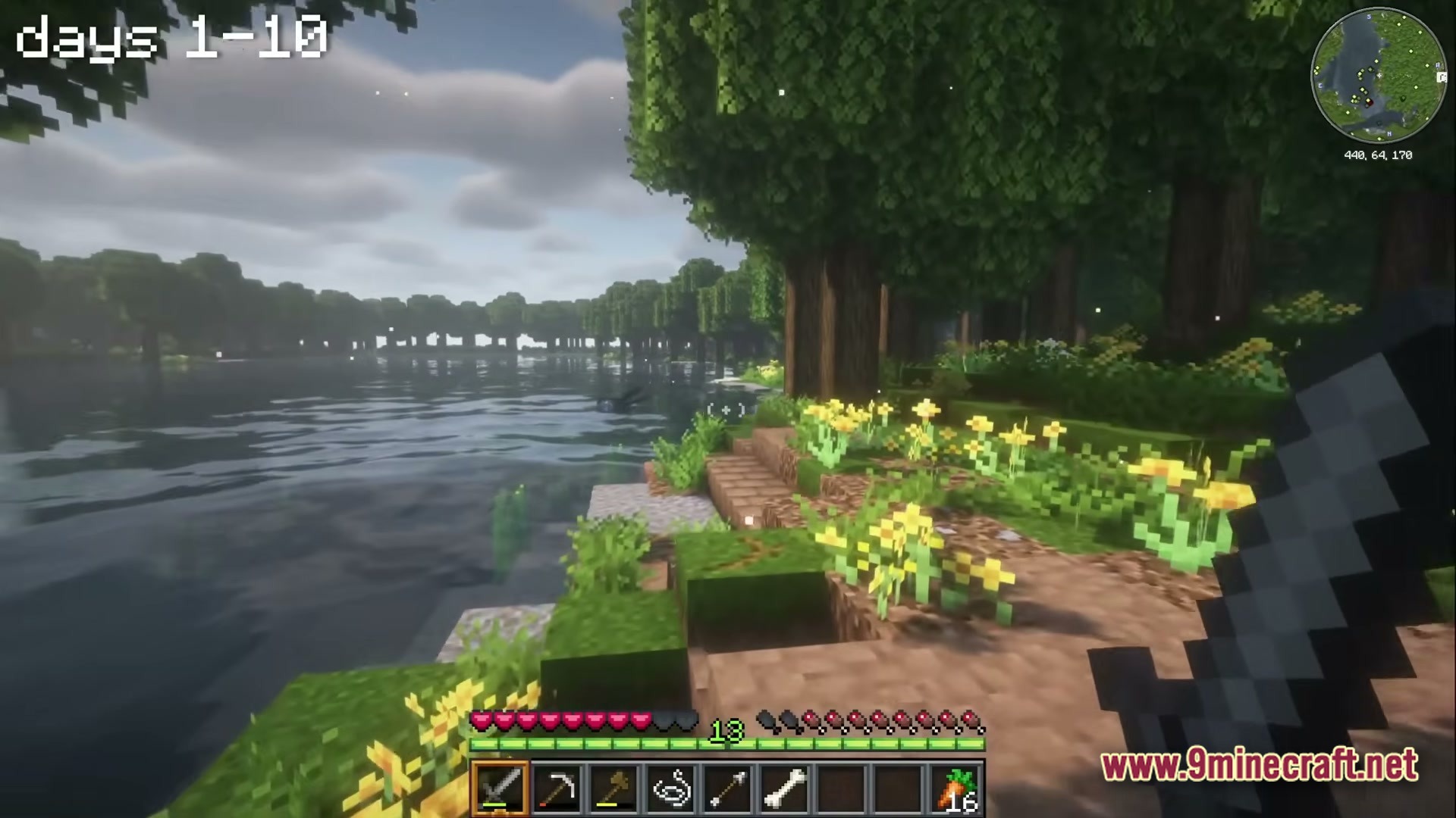 A Cozy Mizuno World Modpack Screenshot 2 A first-person view of a riverbank with custom textures, shaders, and a floral forest biome