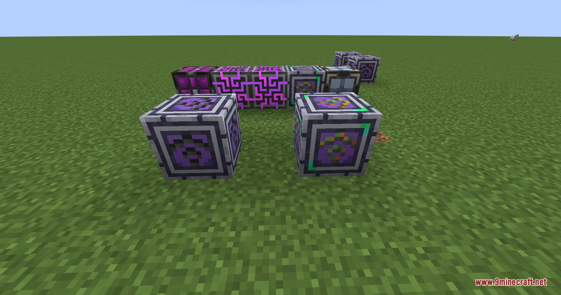 AE Wireless Transceiver Mod Screenshot 2 Various AE Wireless Transceiver Mod blocks and purple cables arranged on grass