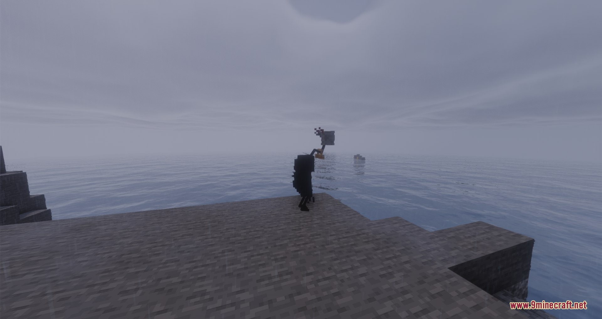 A dark figure stands on a stone platform overlooking a vast foggy ocean
