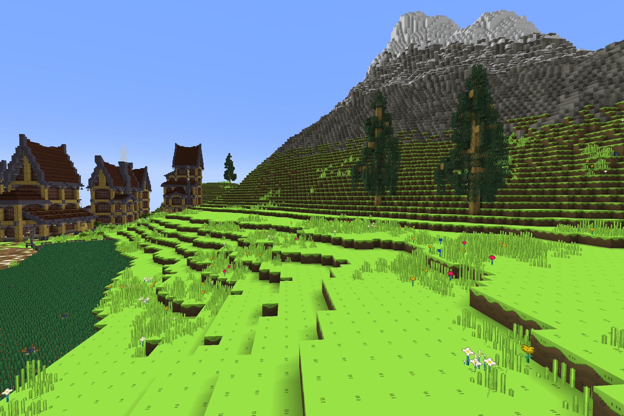 Lush green terraced hills with colorful flowers in a stylized world