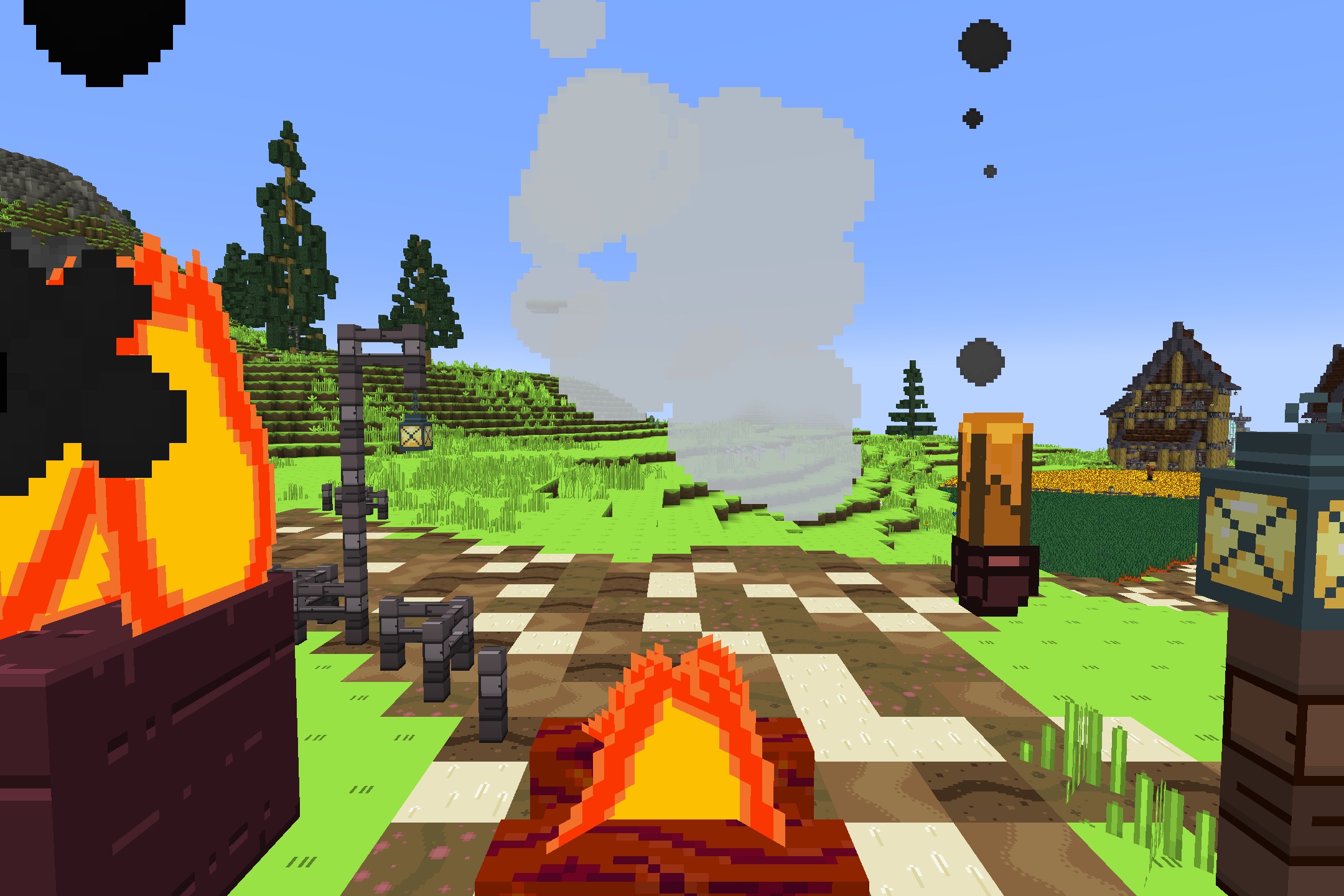 A campfire burns on a path near lanterns and a wooden house