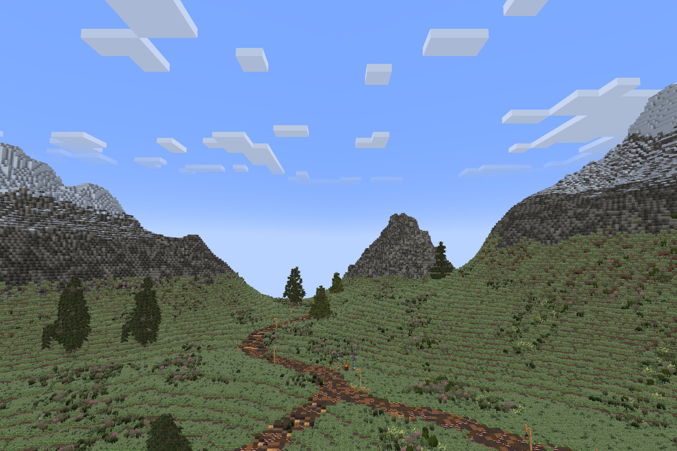 Aeternum Realism Resource Pack Screenshot 5 Winding dirt path through a green valley with mountains under a clear sky