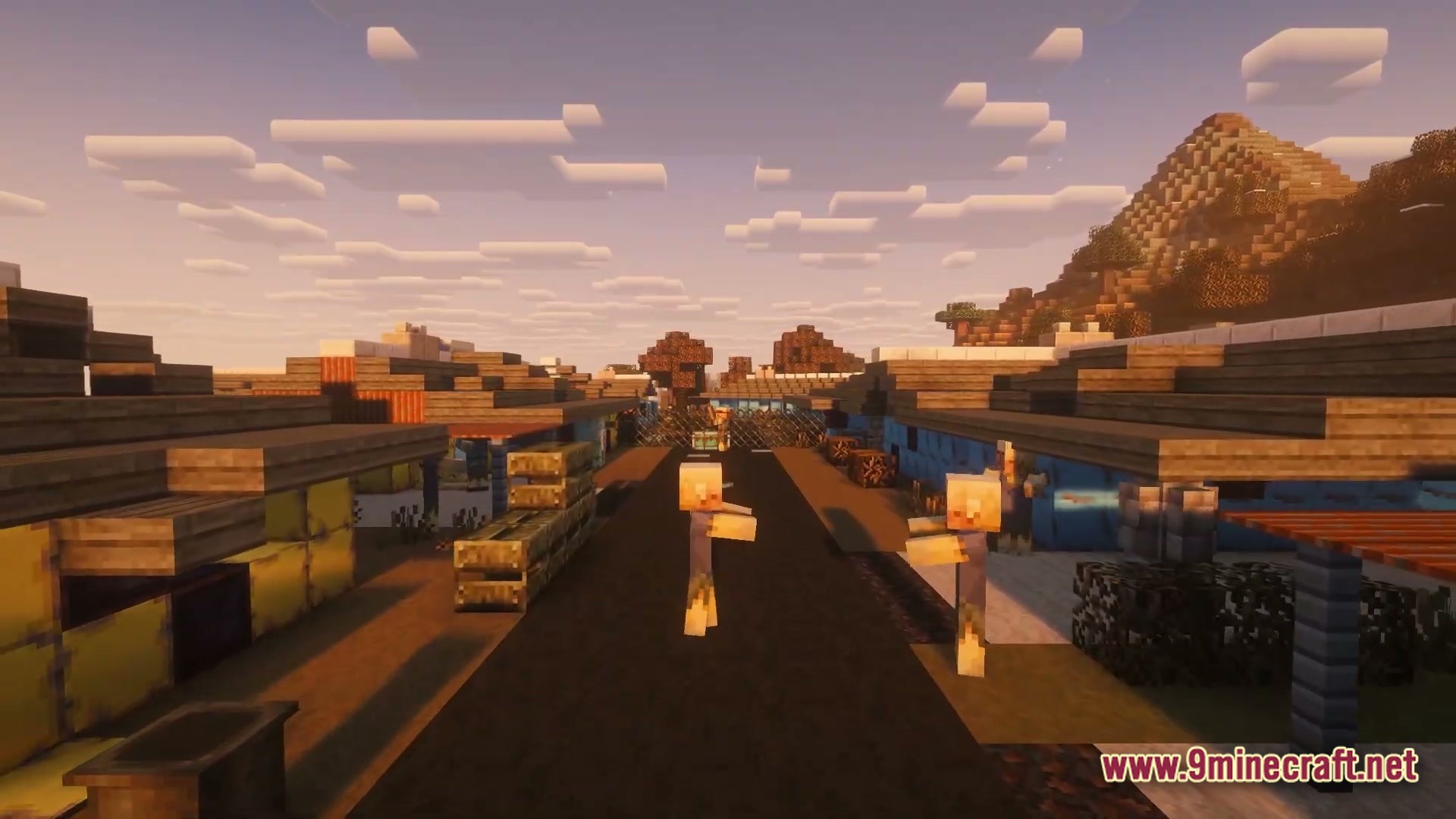 After The Nukes Modpack Screenshot 2 Zombies wander through a post-apocalyptic settlement with makeshift buildings and a paved road at sunset