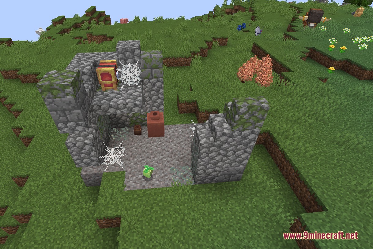 Aio's Extra Structures Mod Screenshot 8 Ruined cobblestone structure with cobwebs and mossy blocks in a grassy field