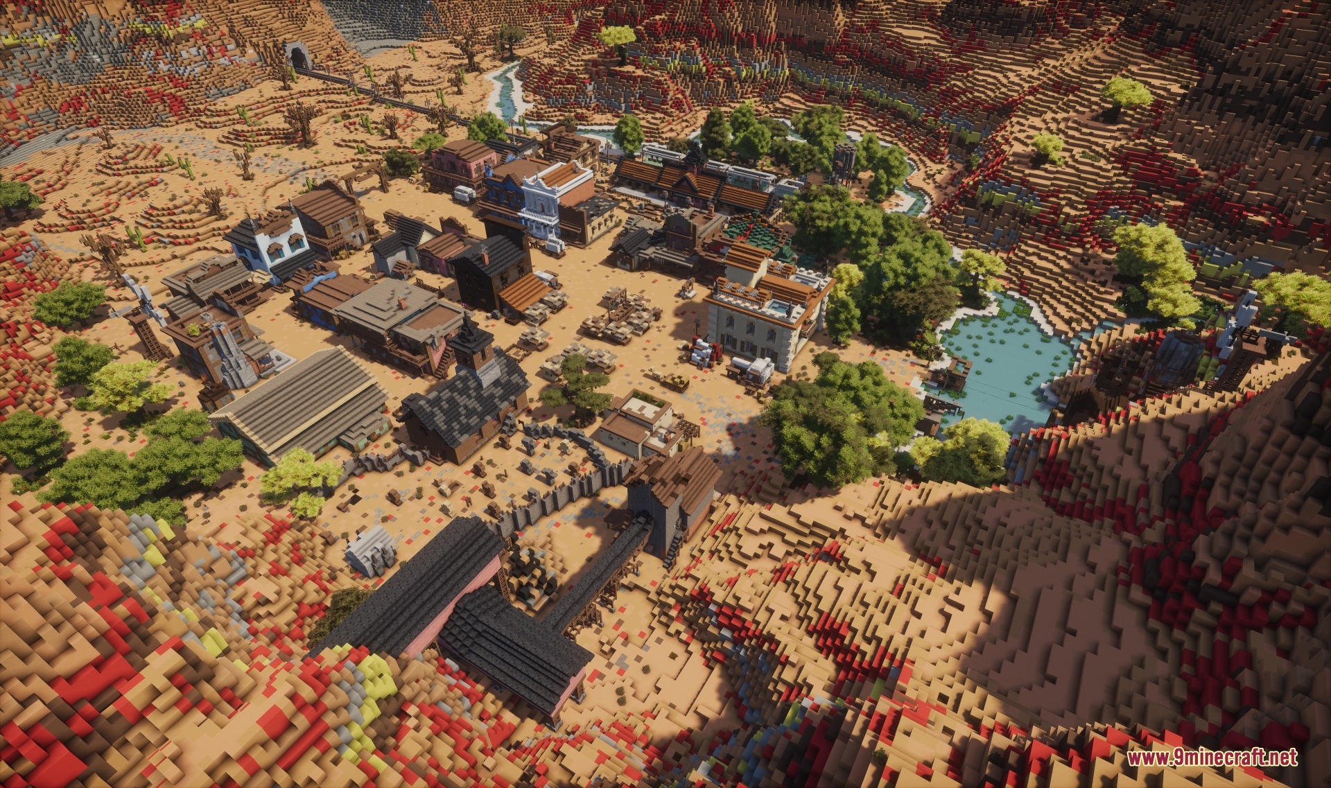 Aerial view of a sprawling Western town built in a desert canyon