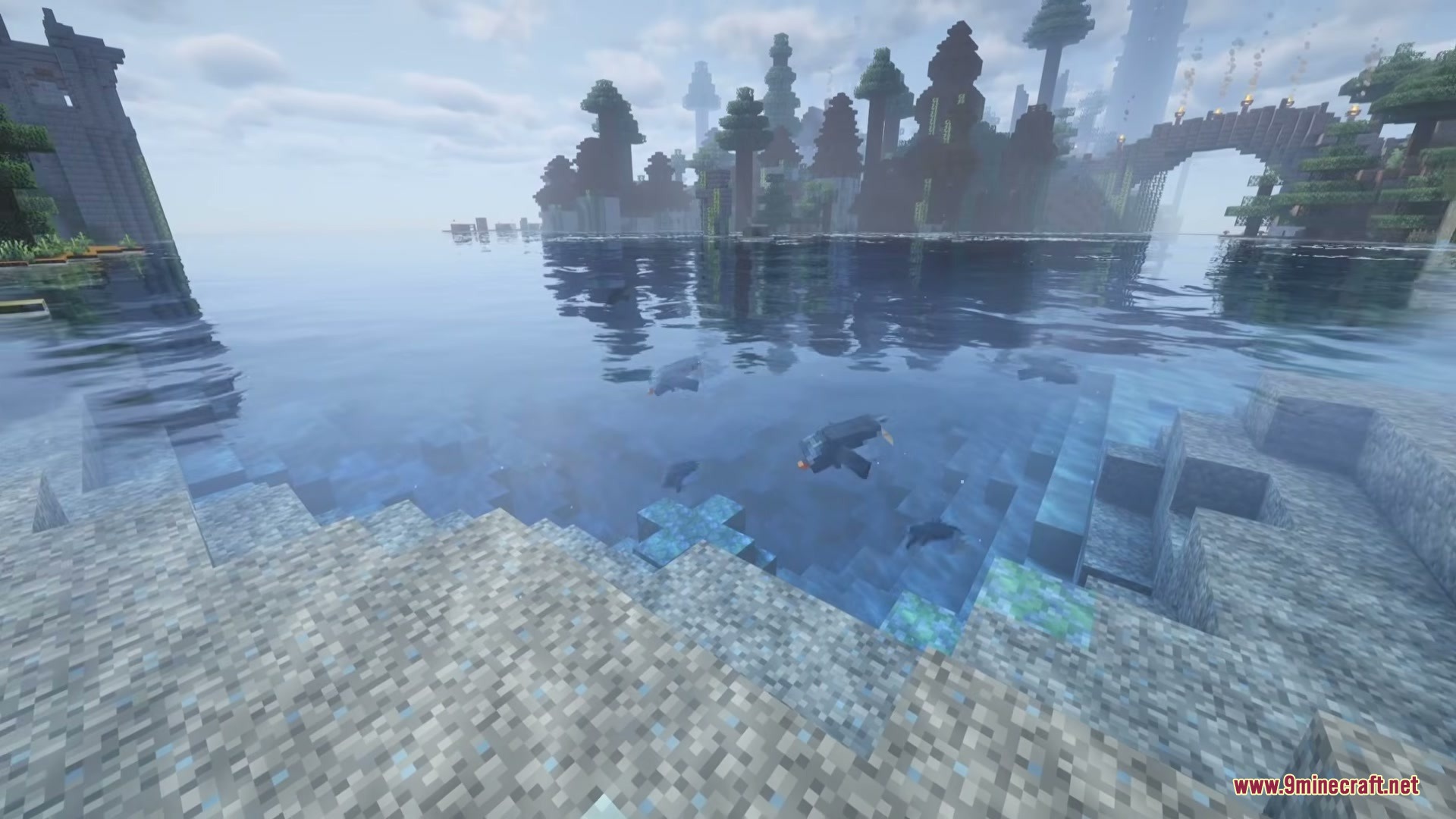 Penguins swimming in the clear blue water near a scenic Minecraft shoreline