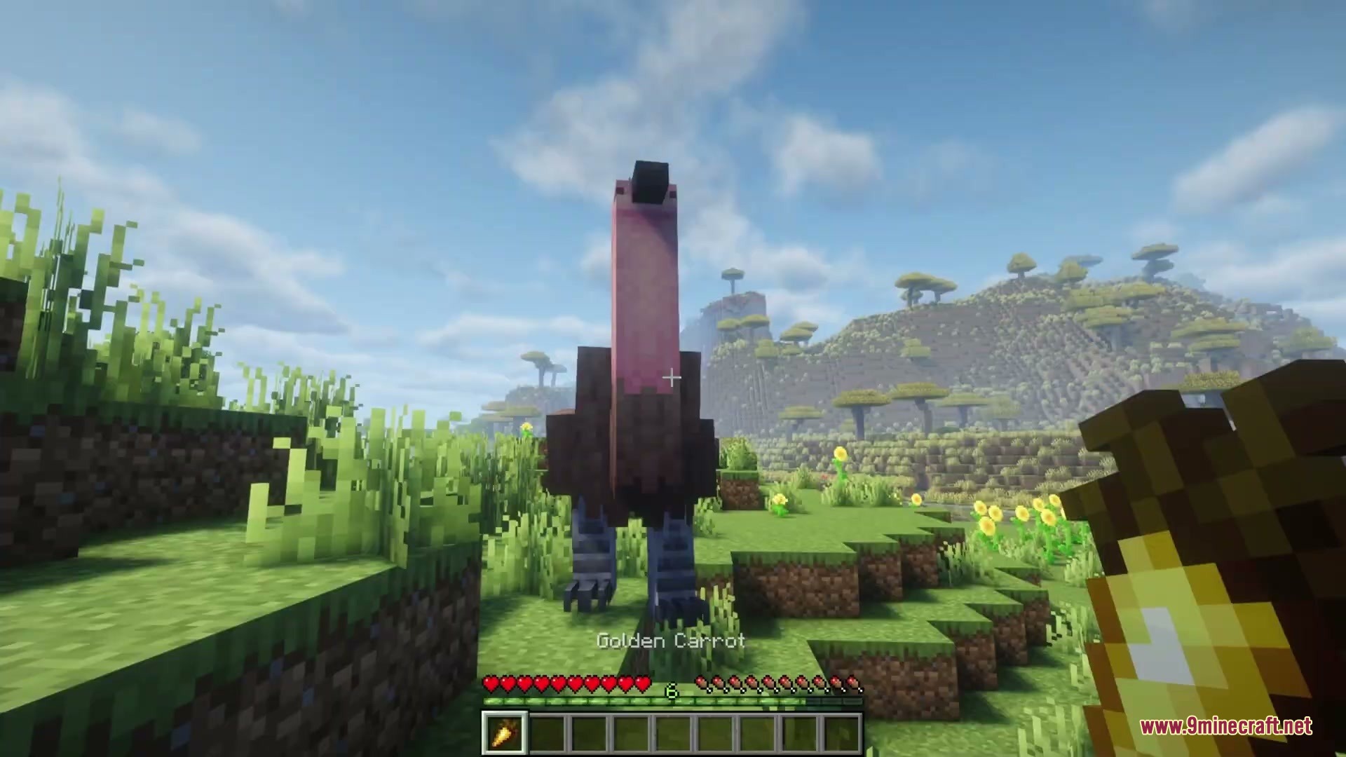 Player holding a golden carrot while looking at a large prehistoric bird