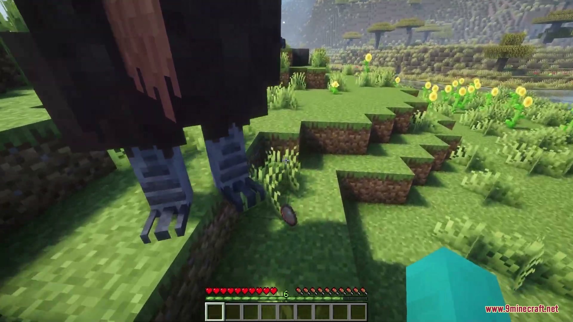 A massive Elephant Bird from Anachronistic Wilds Mod stands in a grassy field