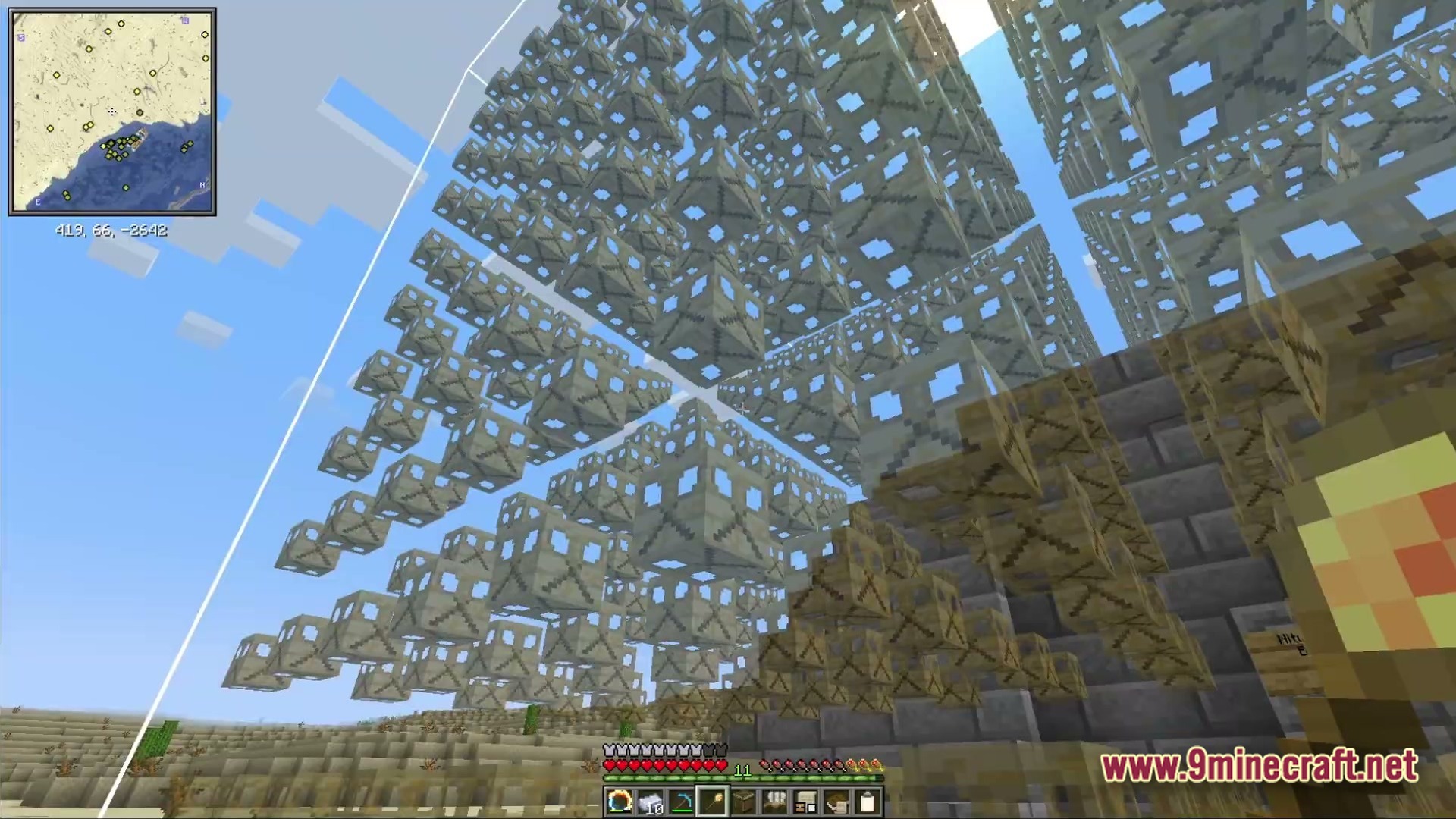 Ancient Kingdoms 3 Modpack Screenshot 4 A massive fractal structure composed of repeating geometric blocks floating above a desert biome