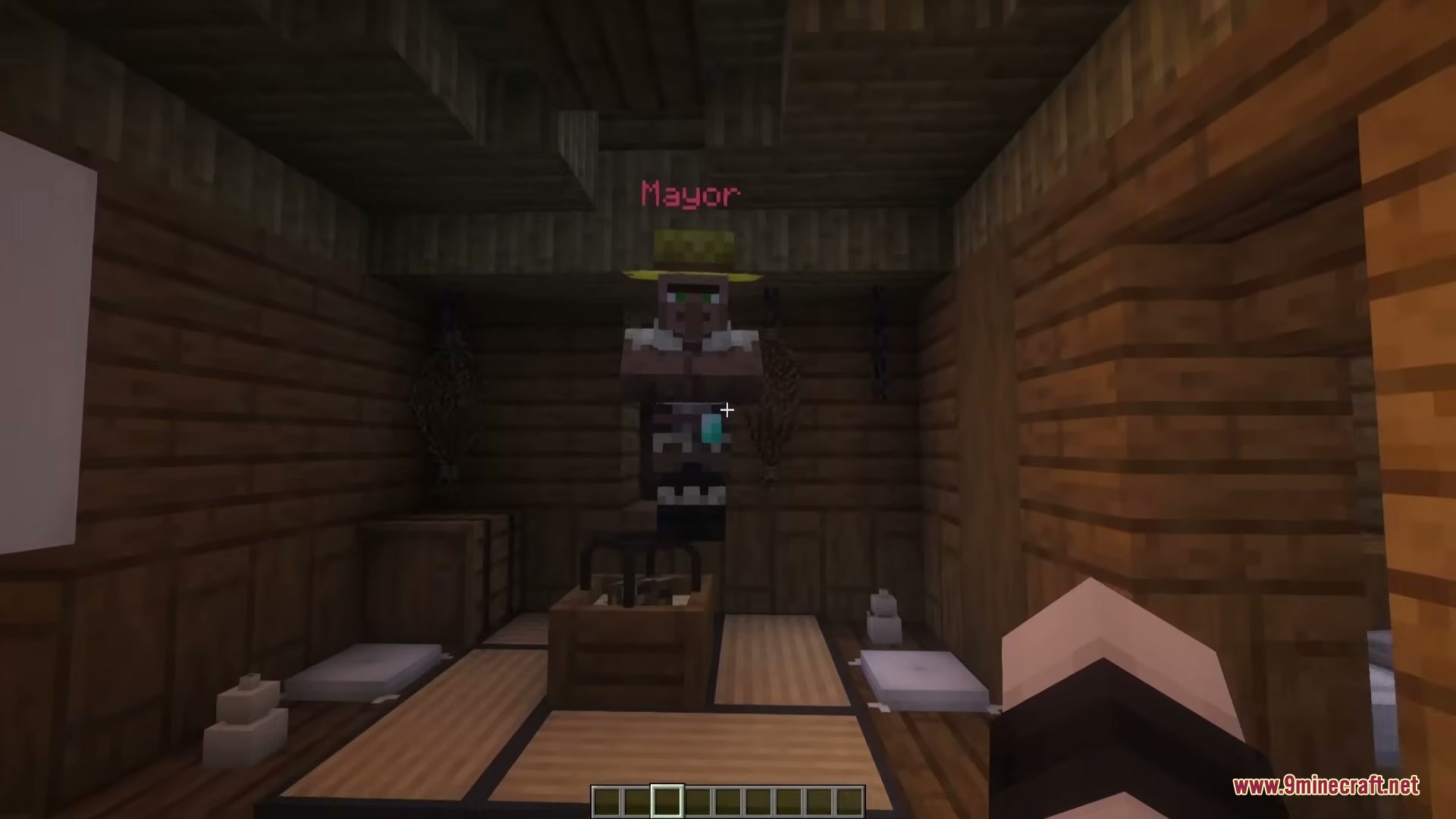 A villager named Mayor standing inside a traditional Japanese style wooden house