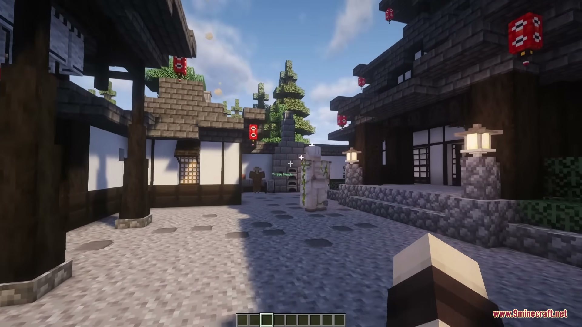 An iron golem stands near Japanese style buildings in a taiga biome