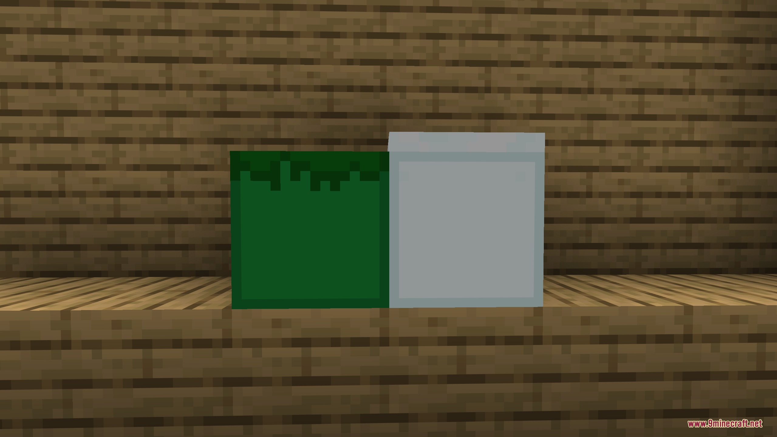 Angular Essence Resource Pack Screenshot 7 Low poly green and grey blocks placed on a wooden surface