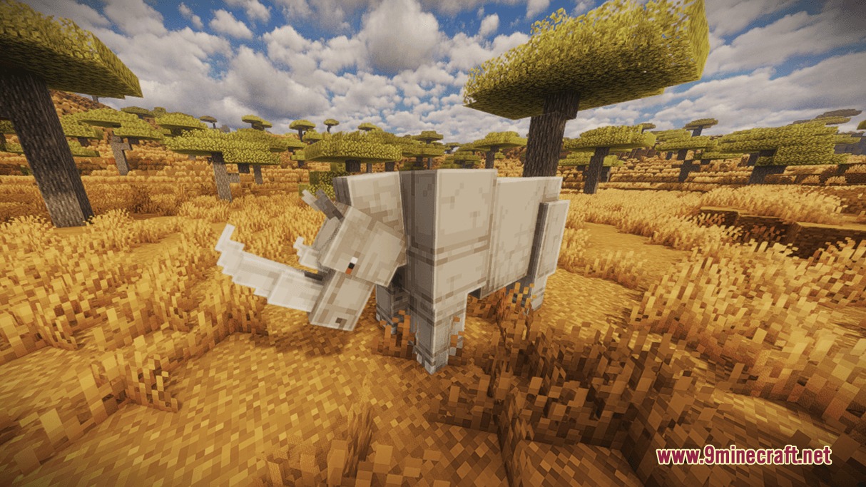 Animalia Exotica Mod Screenshot 7 A large white rhinoceros standing in a grassy savanna biome with acacia trees